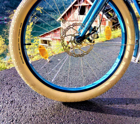 funny bike photos in Balestrand nature aand high mountains and farmhouses