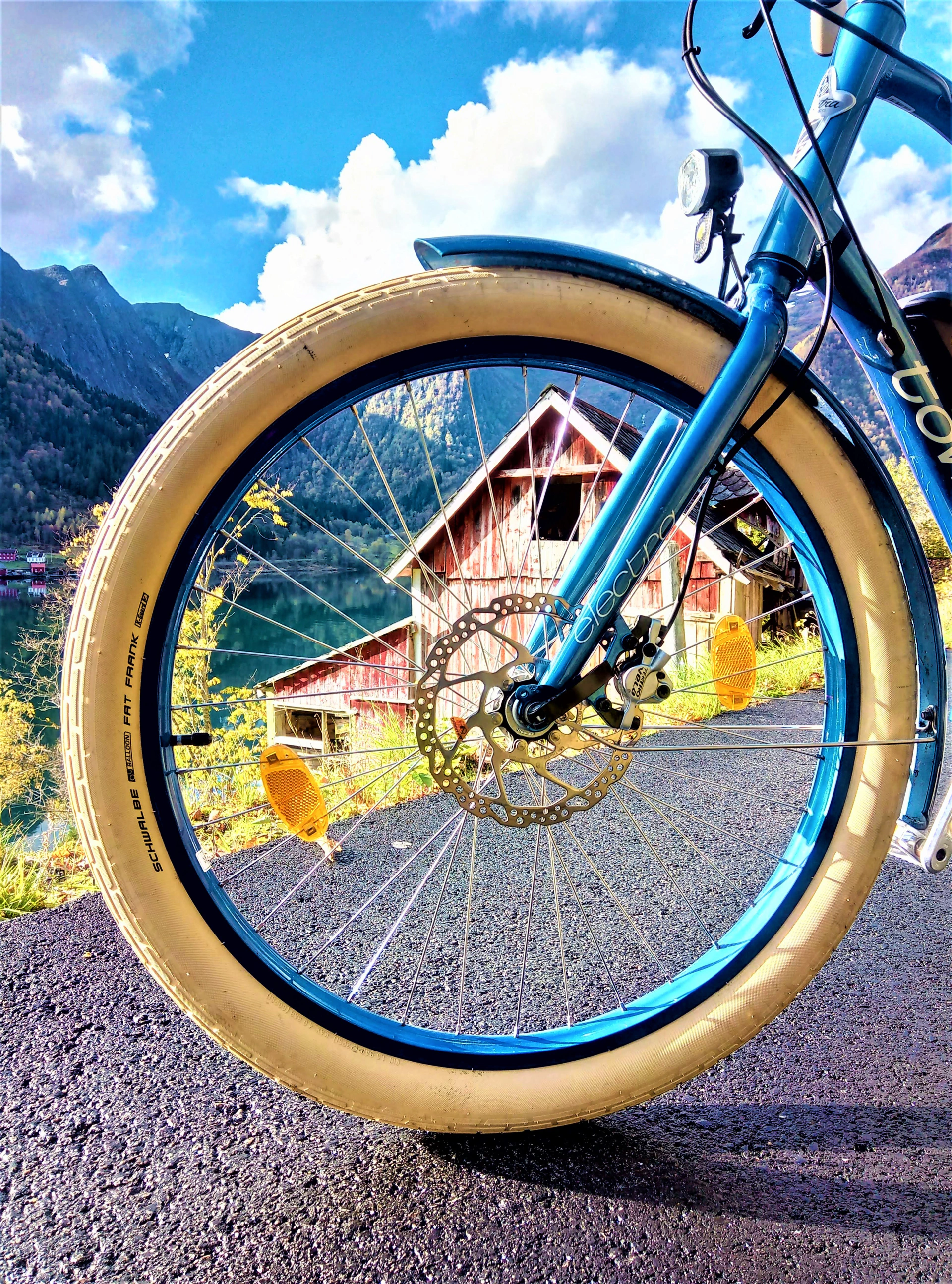 funny bike photos in Balestrand nature aand high mountains and farmhouses