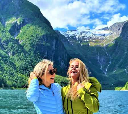"CEO of Visit Sognefjord, Heidi Hauge, experiencing the 'Human Edge' and the serene 'Hyper-nature' of Finnabotn with Balestrand Fjord Angling. A high-end, sustainable fjord tour in the Sognefjord, showcasing authentic Norwegian travel and the emotional power of the pristine landscape."