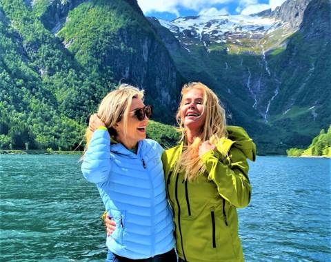 "CEO of Visit Sognefjord, Heidi Hauge, experiencing the 'Human Edge' and the serene 'Hyper-nature' of Finnabotn with Balestrand Fjord Angling. A high-end, sustainable fjord tour in the Sognefjord, showcasing authentic Norwegian travel and the emotional power of the pristine landscape."