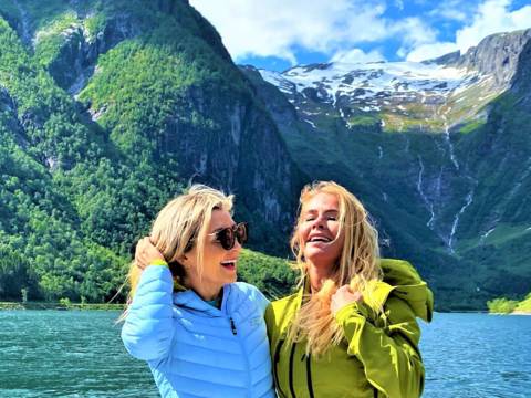 "CEO of Visit Sognefjord, Heidi Hauge, experiencing the 'Human Edge' and the serene 'Hyper-nature' of Finnabotn with Balestrand Fjord Angling. A high-end, sustainable fjord tour in the Sognefjord, showcasing authentic Norwegian travel and the emotional power of the pristine landscape."