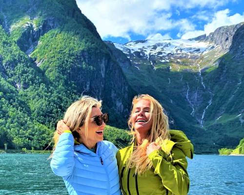 "CEO of Visit Sognefjord, Heidi Hauge, experiencing the 'Human Edge' and the serene 'Hyper-nature' of Finnabotn with Balestrand Fjord Angling. A high-end, sustainable fjord tour in the Sognefjord, showcasing authentic Norwegian travel and the emotional power of the pristine landscape."