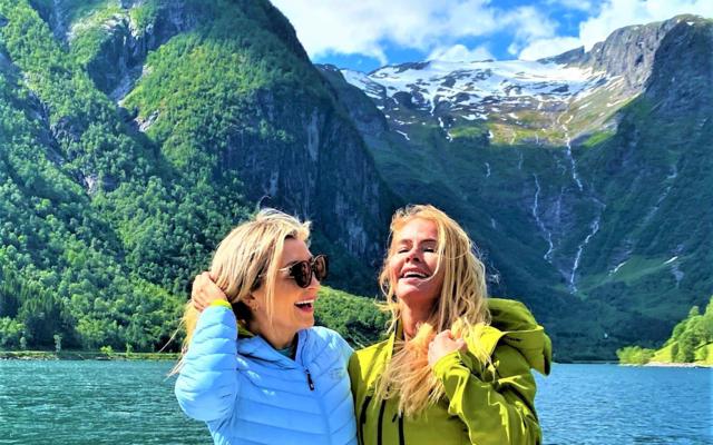 "CEO of Visit Sognefjord, Heidi Hauge, experiencing the 'Human Edge' and the serene 'Hyper-nature' of Finnabotn with Balestrand Fjord Angling. A high-end, sustainable fjord tour in the Sognefjord, showcasing authentic Norwegian travel and the emotional power of the pristine landscape."