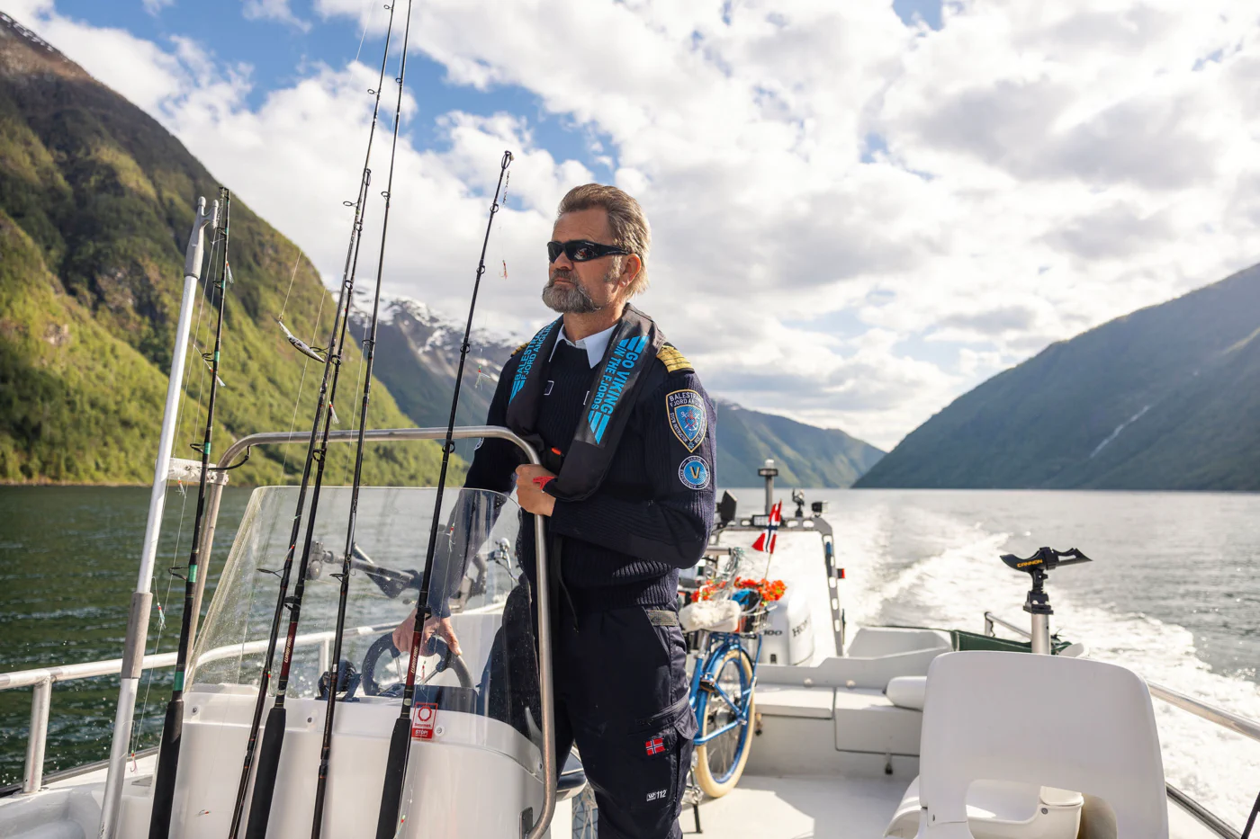 Captain Tor at the helm of his boat in the Sognefjord Professional authentic fishing trip with focus on local expertise and sustainable travel