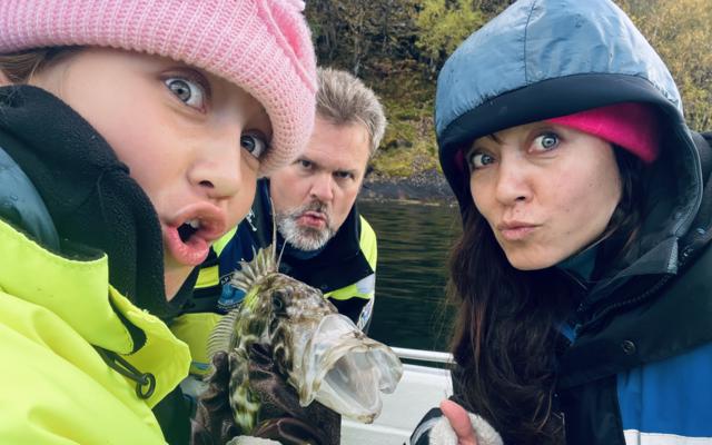 Mother and daughter and funny fish, on viking fishing adventure in sognefjord with captain Tor