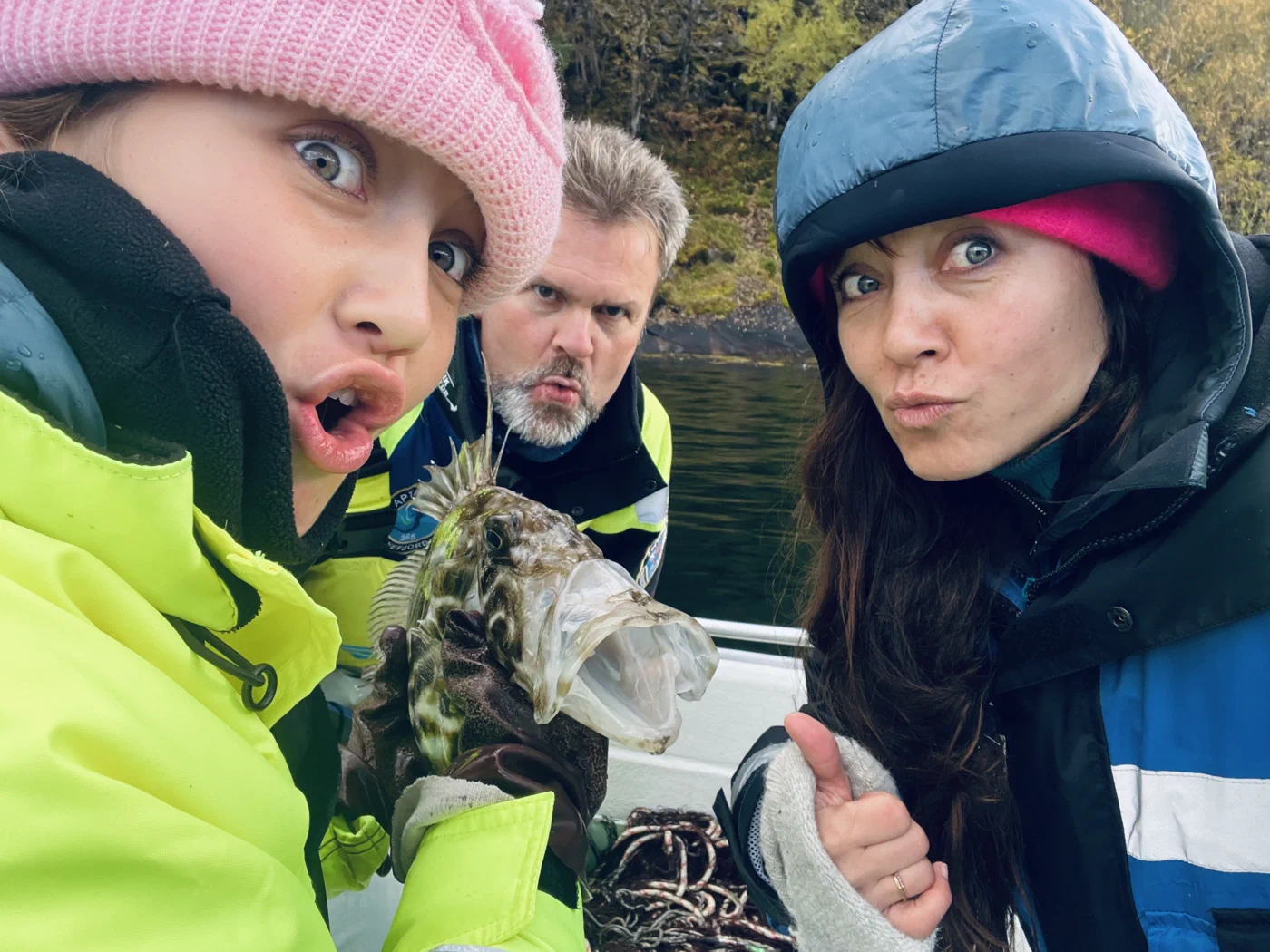 Mother and daughter and funny fish, on viking fishing adventure in sognefjord with captain Tor