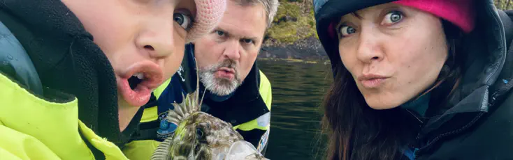 Mother and daughter and funny fish, on viking fishing adventure in sognefjord with captain Tor